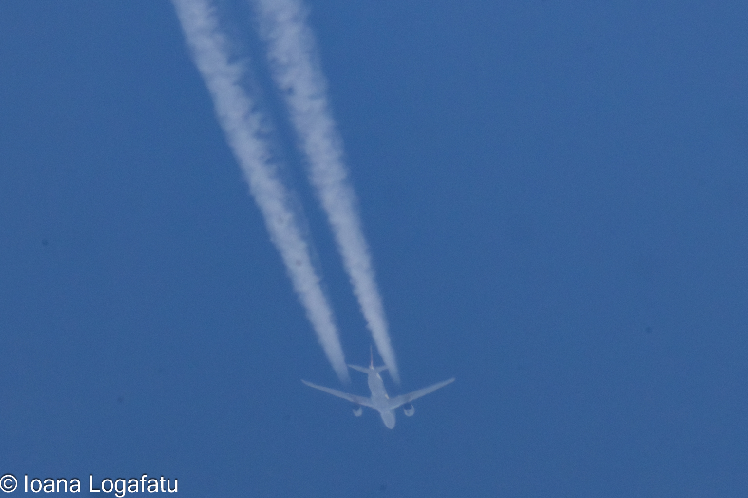 Jet soaring across a blue sky